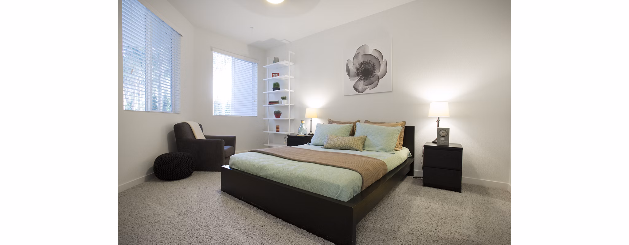 Eton at Warner Center: Cozy bedroom with modern decor and ample natural light in luxury apartments