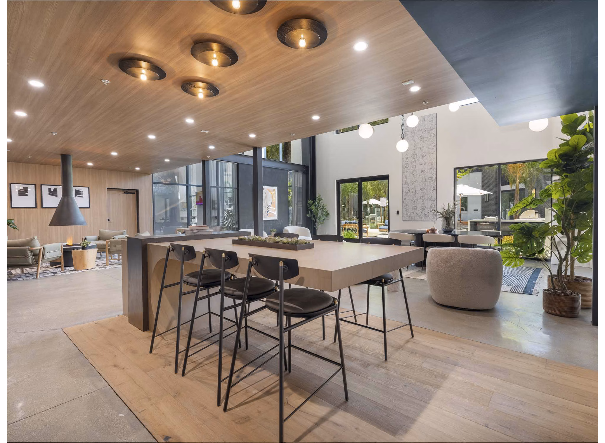 Clubhouse featuring modern decor and seating at Eton at Warner Center Apartments