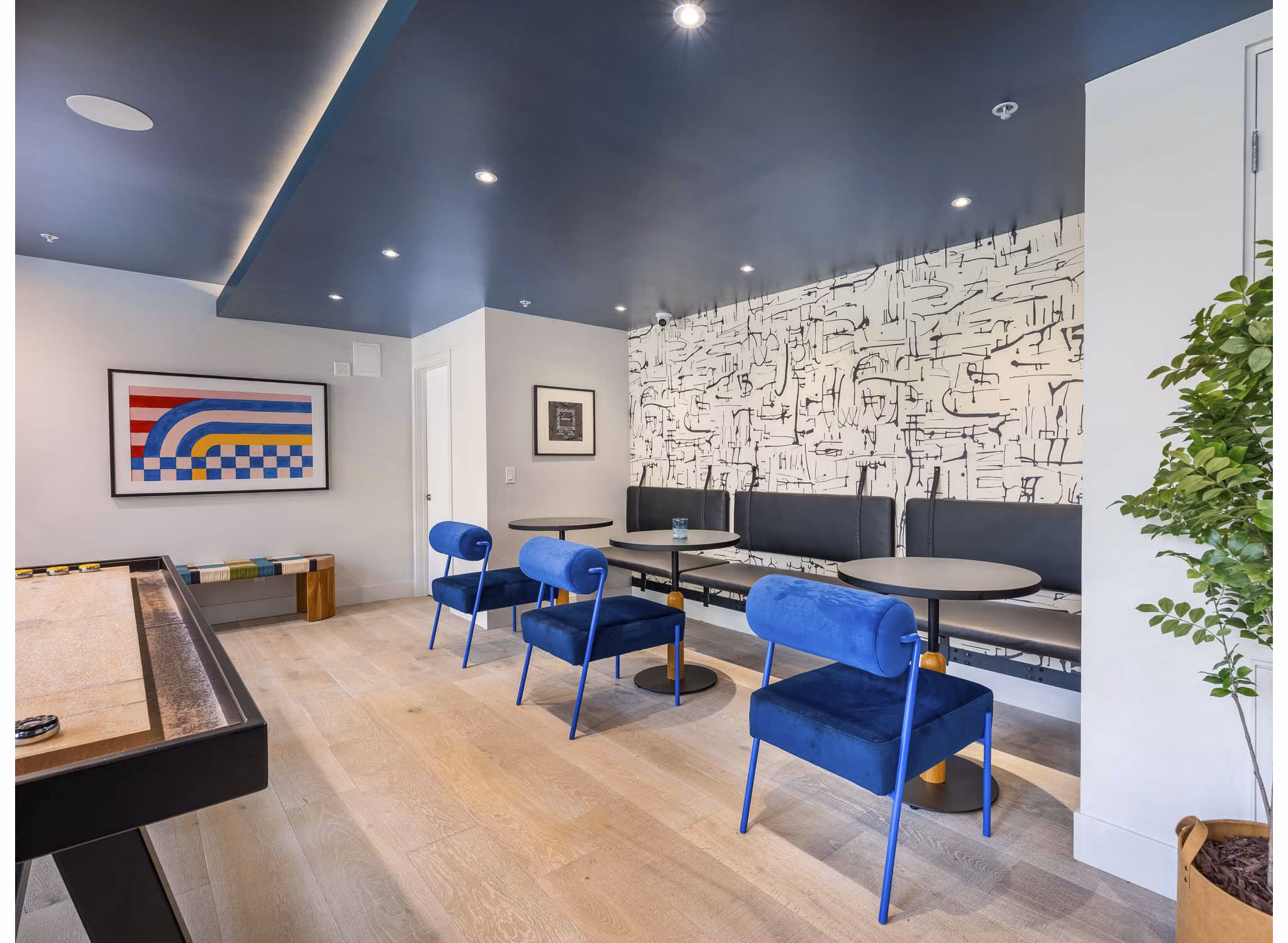 Clubhouse featuring modern design and cozy seating at Eton at Warner Center Apartments