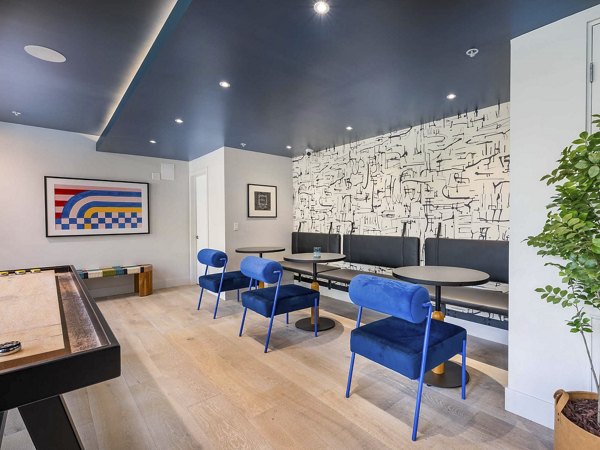 Clubhouse featuring modern design and cozy seating at Eton at Warner Center Apartments