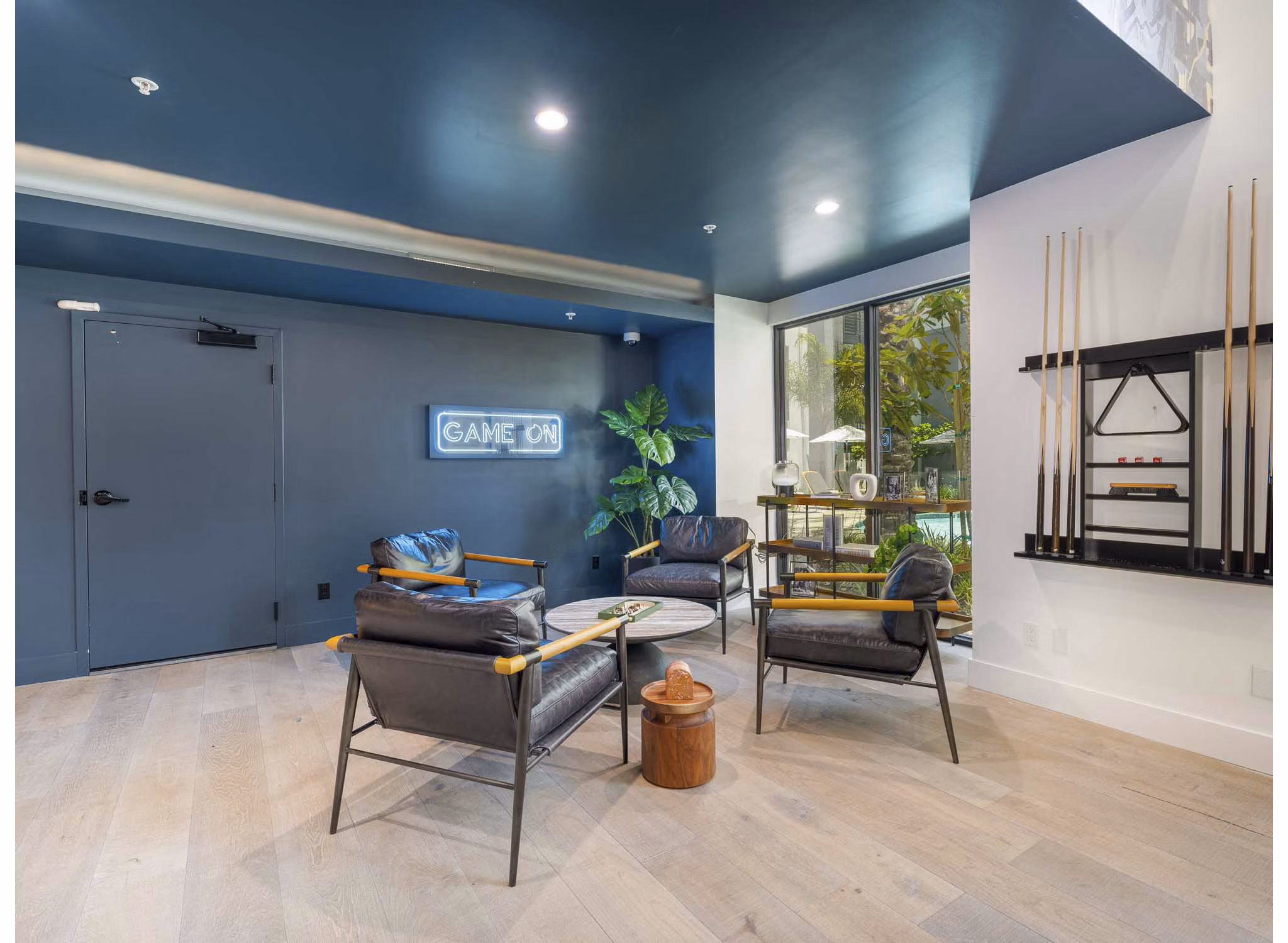 Eton at Warner Center: Contemporary clubhouse featuring modern design and spacious seating areas in luxury apartments
