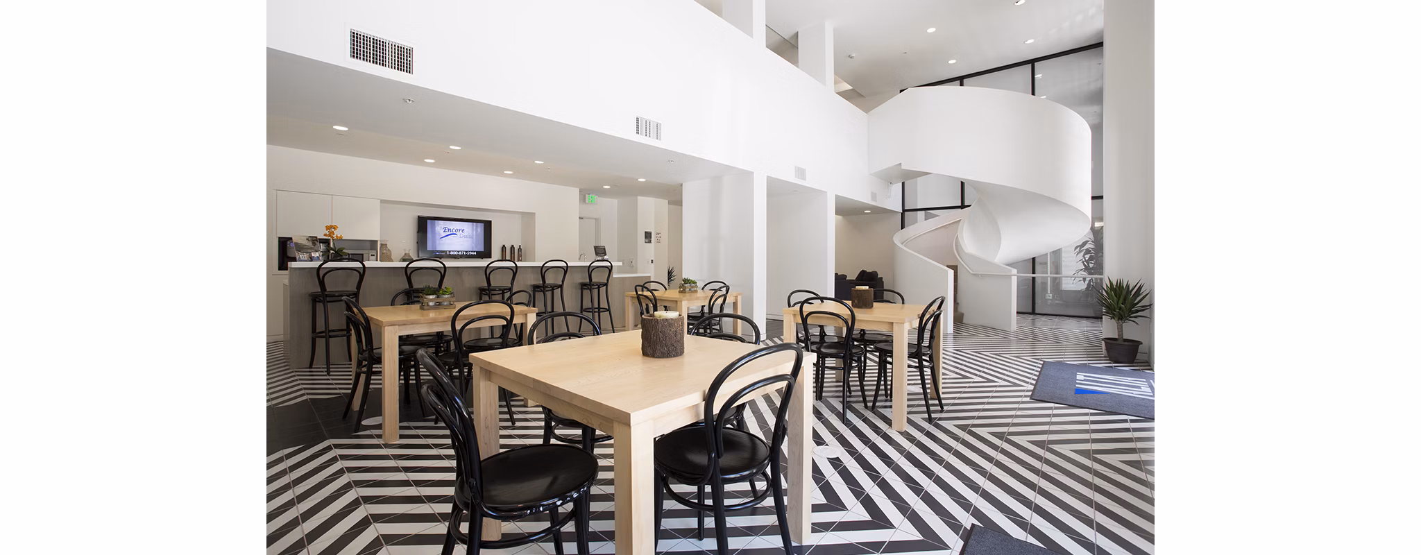 Eton at Warner Center: Stylish clubhouse with modern decor and seating, perfect for gatherings and relaxation