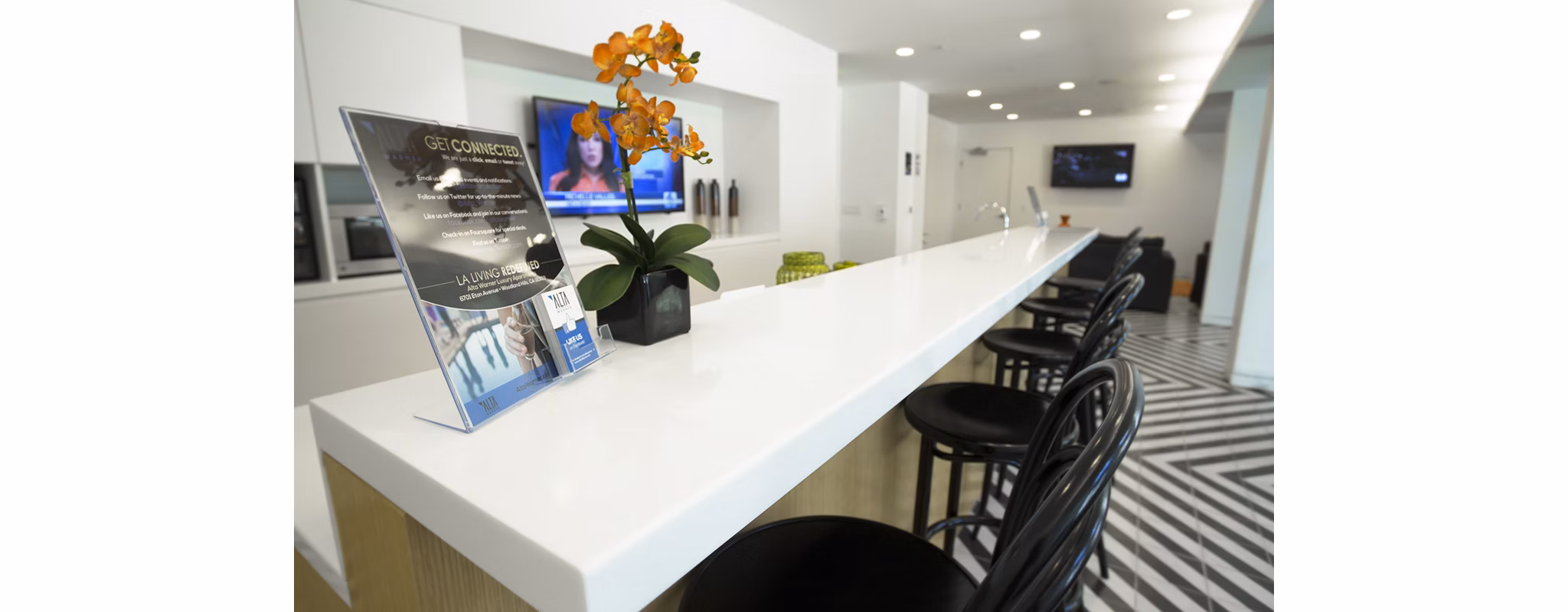 Eton at Warner Center: Elegant clubhouse with modern furnishings and open seating areas in a luxury Greystar apartment community