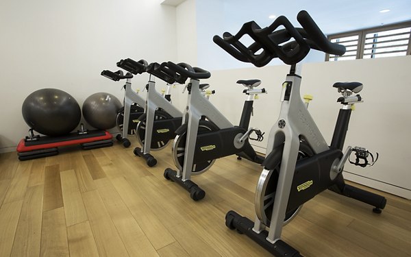 Modern fitness center with state-of-the-art equipment at Eton at Warner Center Apartments, ideal for an active lifestyle