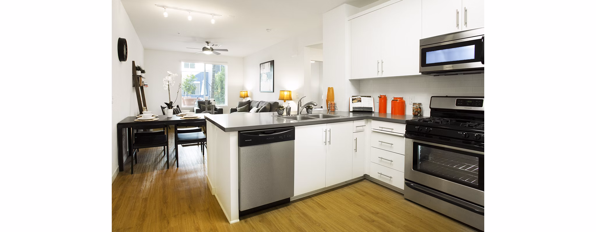 Modern kitchen with stainless steel appliances and granite countertops at Eton at Warner Center Apartments, Greystar luxury living