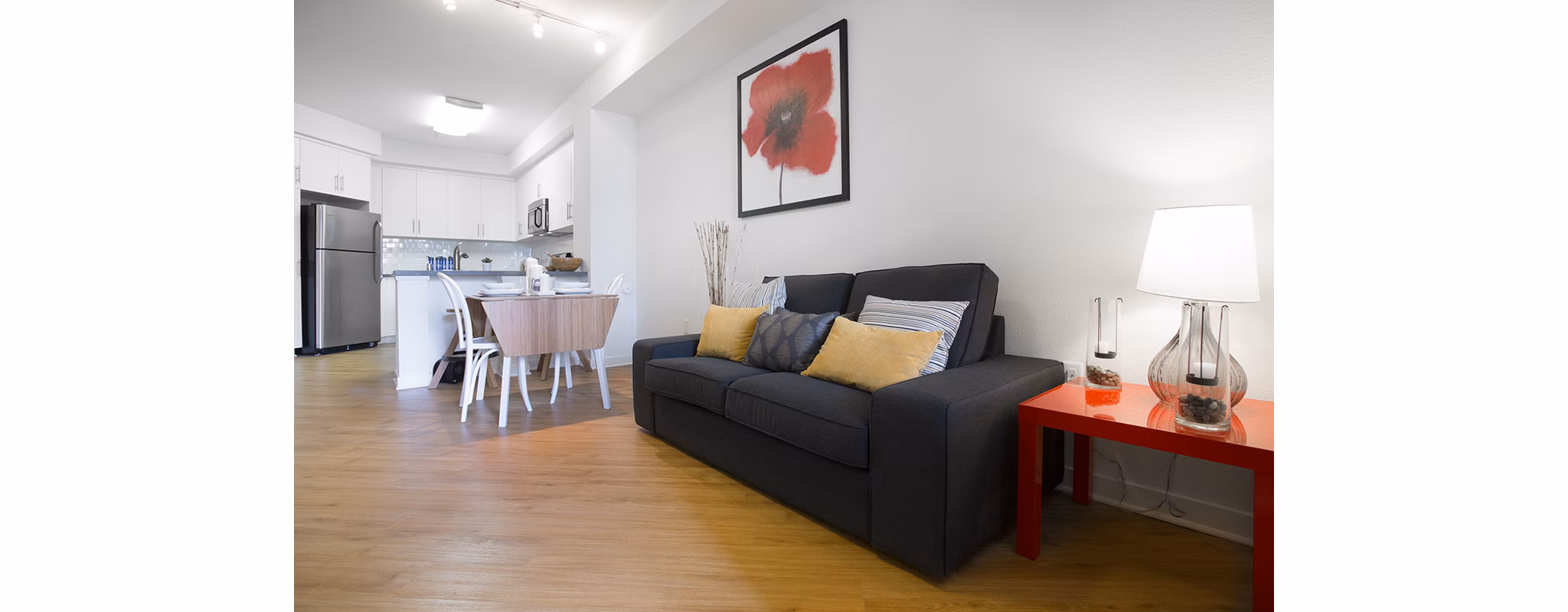 Spacious living room with modern decor and natural light in Eton at Warner Center Apartments