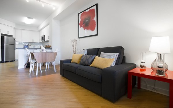 Spacious living room with modern decor and natural light in Eton at Warner Center Apartments