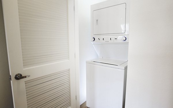 Laundry room at Eton at Warner Center Apartments