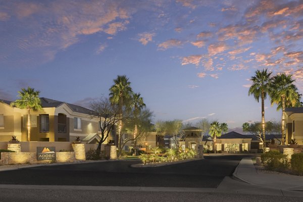 Modern clubhouse with cozy seating and billiards table at Adobe Ridge Apartments