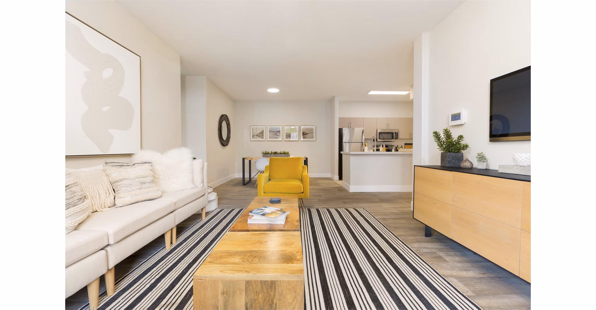 Spacious living room with modern decor at Adobe Ridge Apartments, offering comfort and style in a luxury setting
