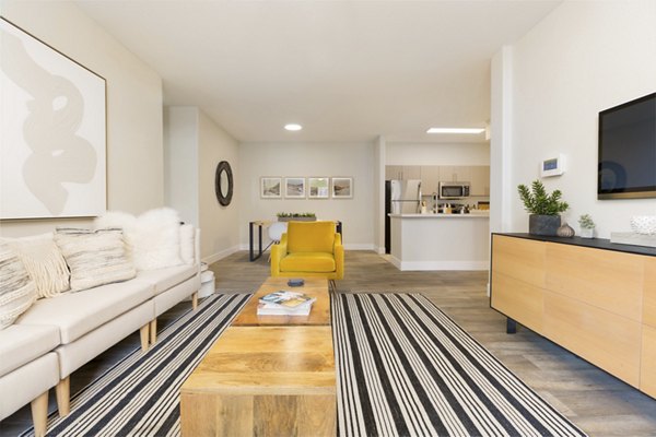 Spacious living room with modern decor at Adobe Ridge Apartments, offering comfort and style in a luxury setting