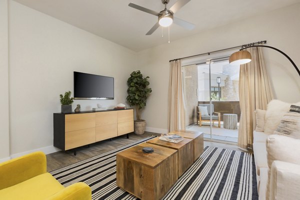 Living room with modern decor and natural light at Adobe Ridge Apartments