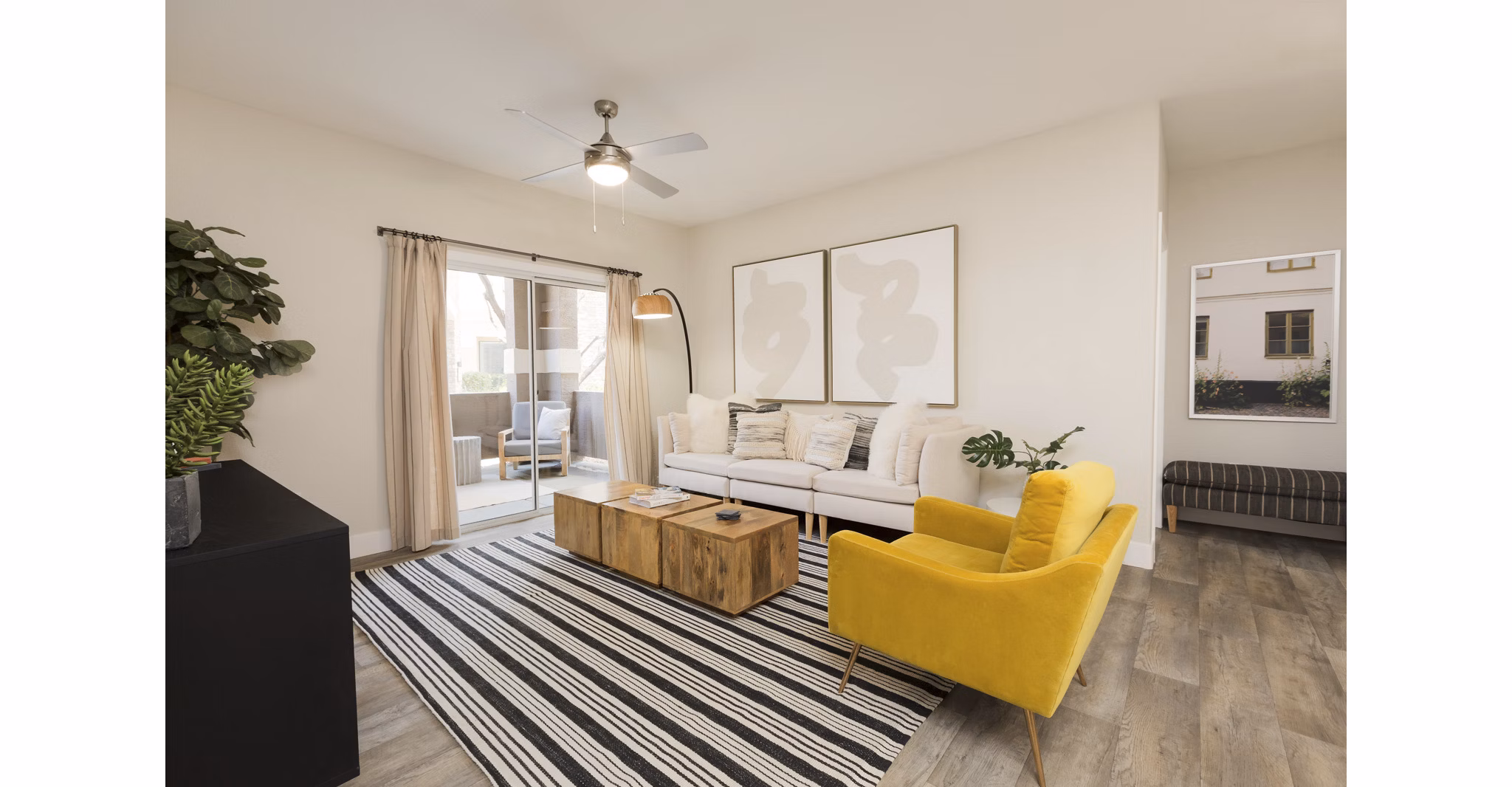 Spacious living room with modern decor at Adobe Ridge Apartments, perfect for comfortable living and relaxation