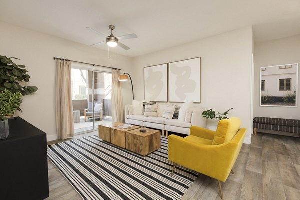 Spacious living room with modern decor at Adobe Ridge Apartments, perfect for comfortable living and relaxation