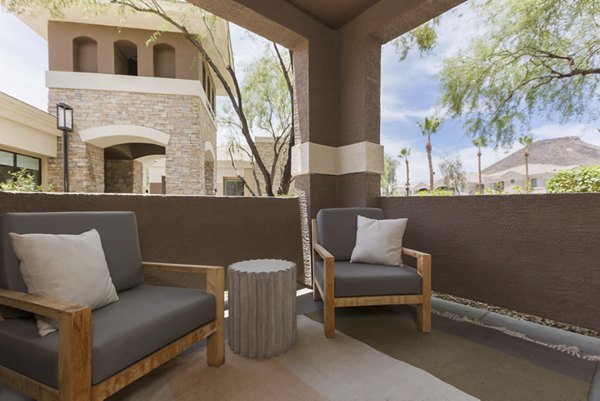 Modern patio with seating area at Adobe Ridge Apartments, Greystar luxury property