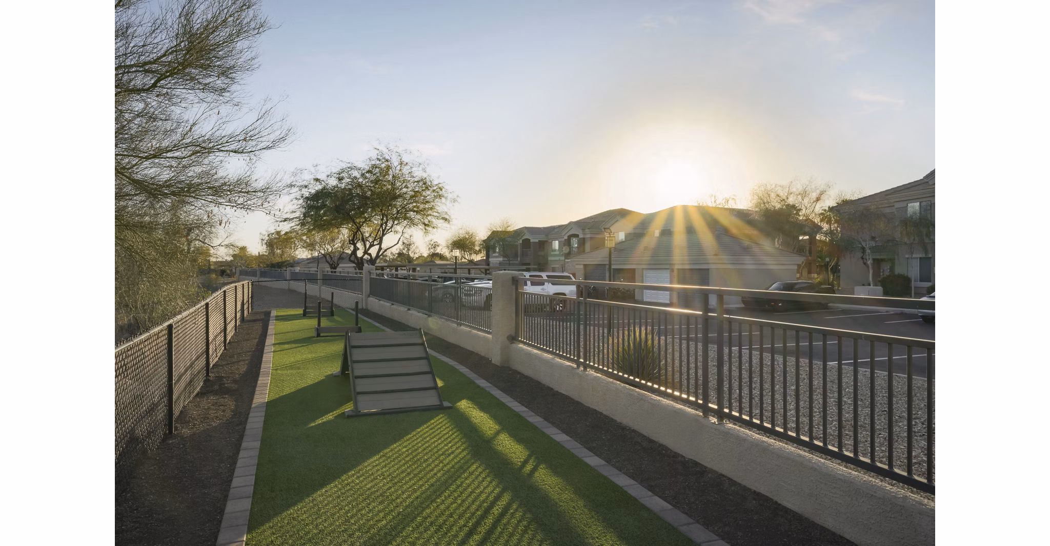 Well-maintained dog park with agility equipment at Adobe Ridge Apartments