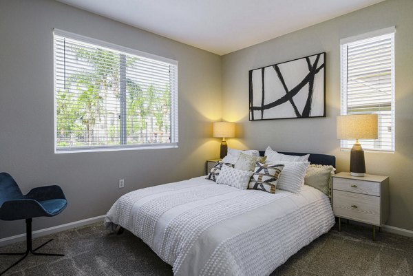 Cozy bedroom with modern design at Canyon Park Apartments, featuring plush bedding and stylish decor