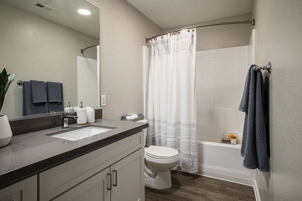 Elegant bathroom with marble countertops at Canyon Park Apartments, featuring luxury fixtures for a relaxing experience