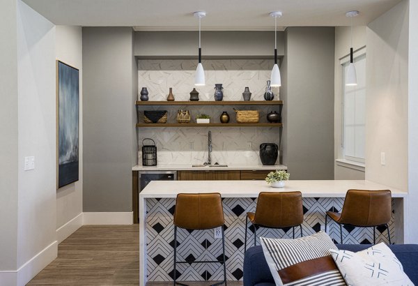 Clubhouse with modern design and community seating at Canyon Park Apartments, offering a luxury lifestyle in a serene setting