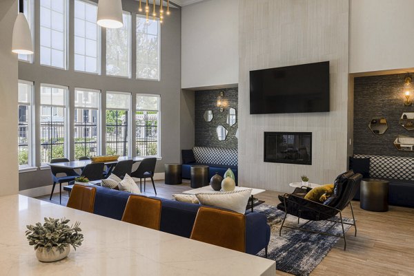 Modernly-designed clubhouse at Canyon Park Apartments with cozy seating and abundant natural light