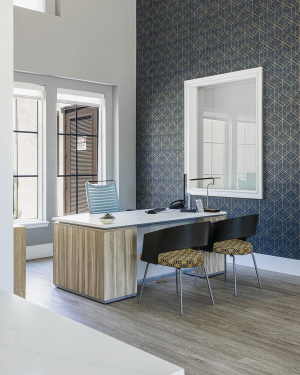 Clubhouse with modern design at Canyon Park Apartments featuring luxurious seating and a cozy fireplace