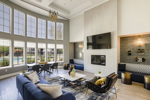 Modern clubhouse featuring cozy seating and large windows at Canyon Park Apartments