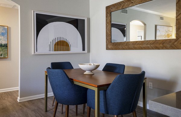 Dining area with sleek furnishings and modern lighting in Canyon Park Apartments