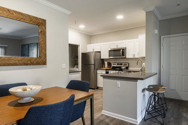 Dining area with elegant furnishings at Canyon Park Apartments, showcasing luxury living