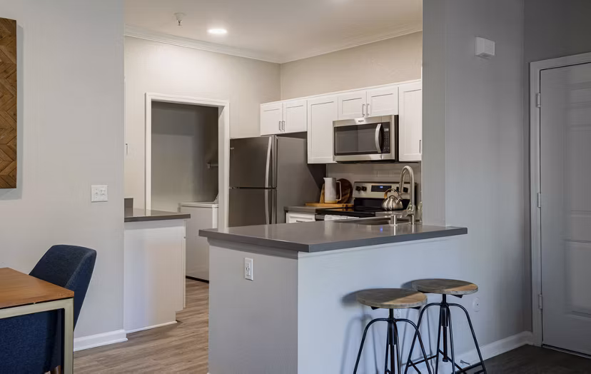 Modern kitchen with stainless steel appliances at Canyon Park Apartments