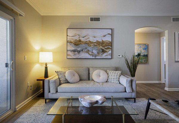 Spacious living room with modern furnishings at Canyon Park Apartments in a serene setting