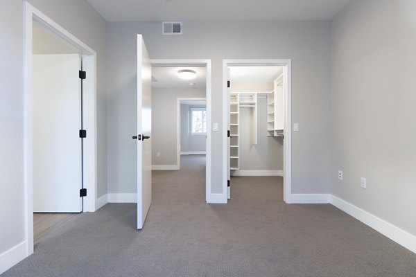 Inviting bedroom with modern furnishings and large window at 599 Castro Apartments