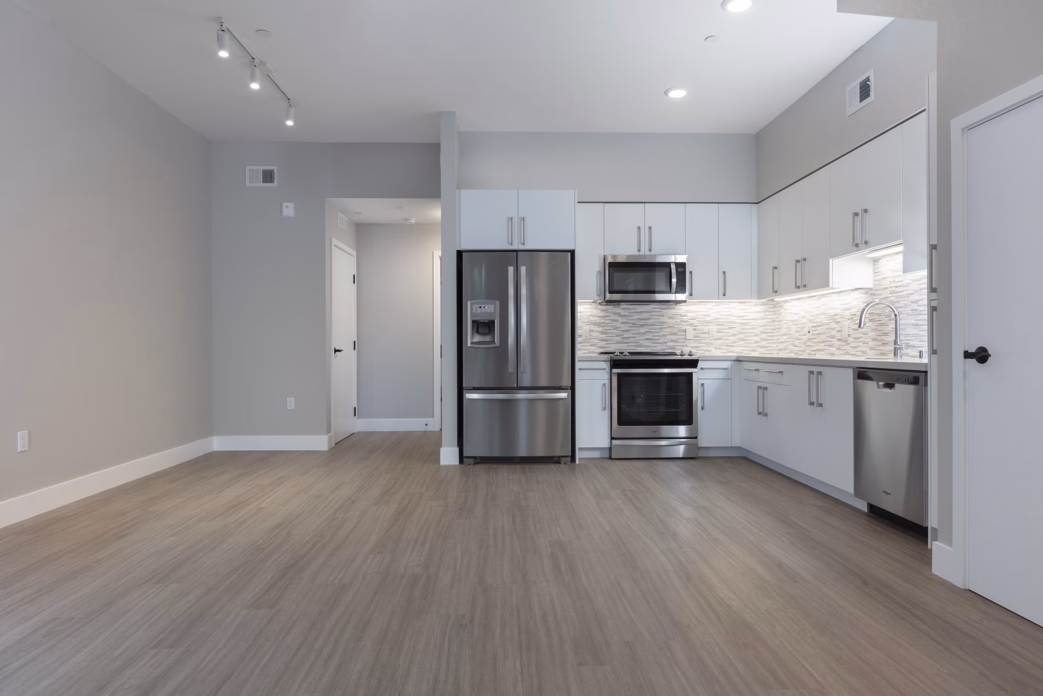 Modern kitchen with sleek appliances and marble countertops in 599 Castro Apartments, luxury living near downtown