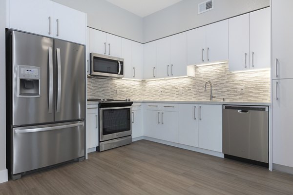 Modern kitchen with stainless steel appliances at 599 Castro Apartments