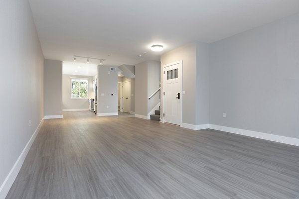 Modern living room with sleek furnishings at 599 Castro Apartments, offering luxury urban living in a prime location