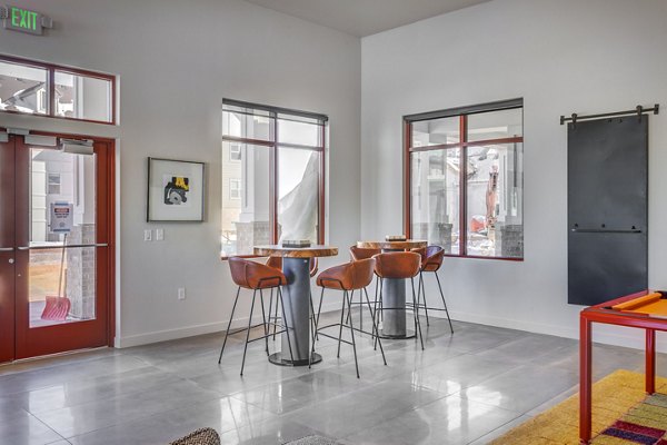 Clubhouse with modern design and cozy seating area at Aspira at Anthem Apartments, ideal for social gatherings and relaxation