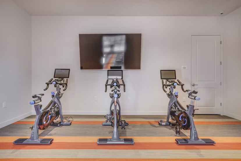 Yoga/spin studio with modern equipment at Aspira at Anthem Apartments
