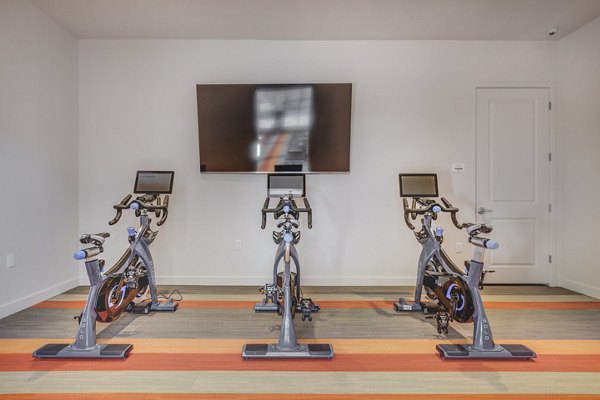 Yoga/spin studio with modern equipment at Aspira at Anthem Apartments