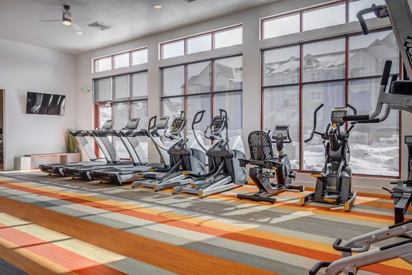 Fitness center equipped with modern exercise machines at Aspira at Anthem Apartments