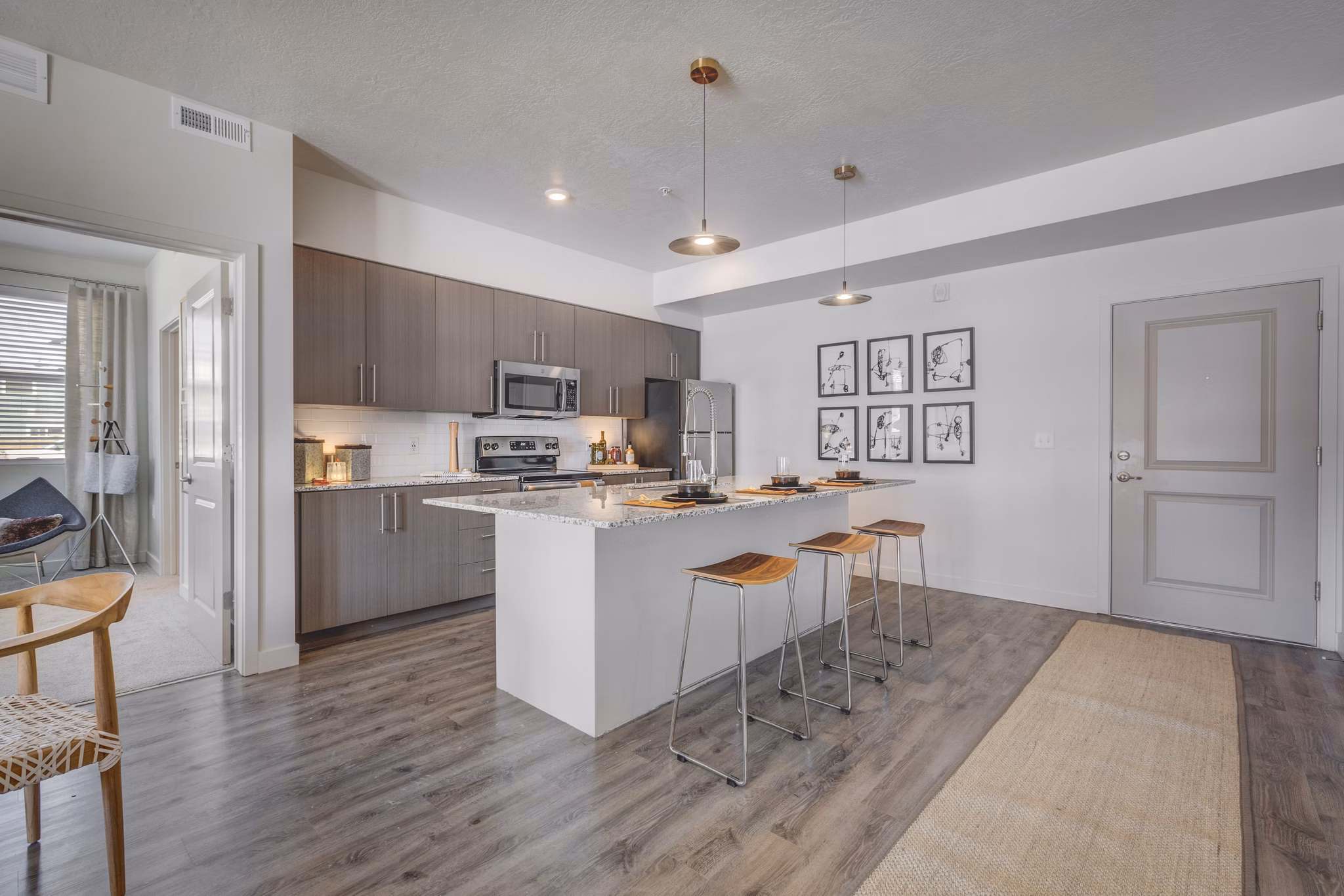 Modern kitchen with stainless steel appliances at Aspira at Anthem Apartments