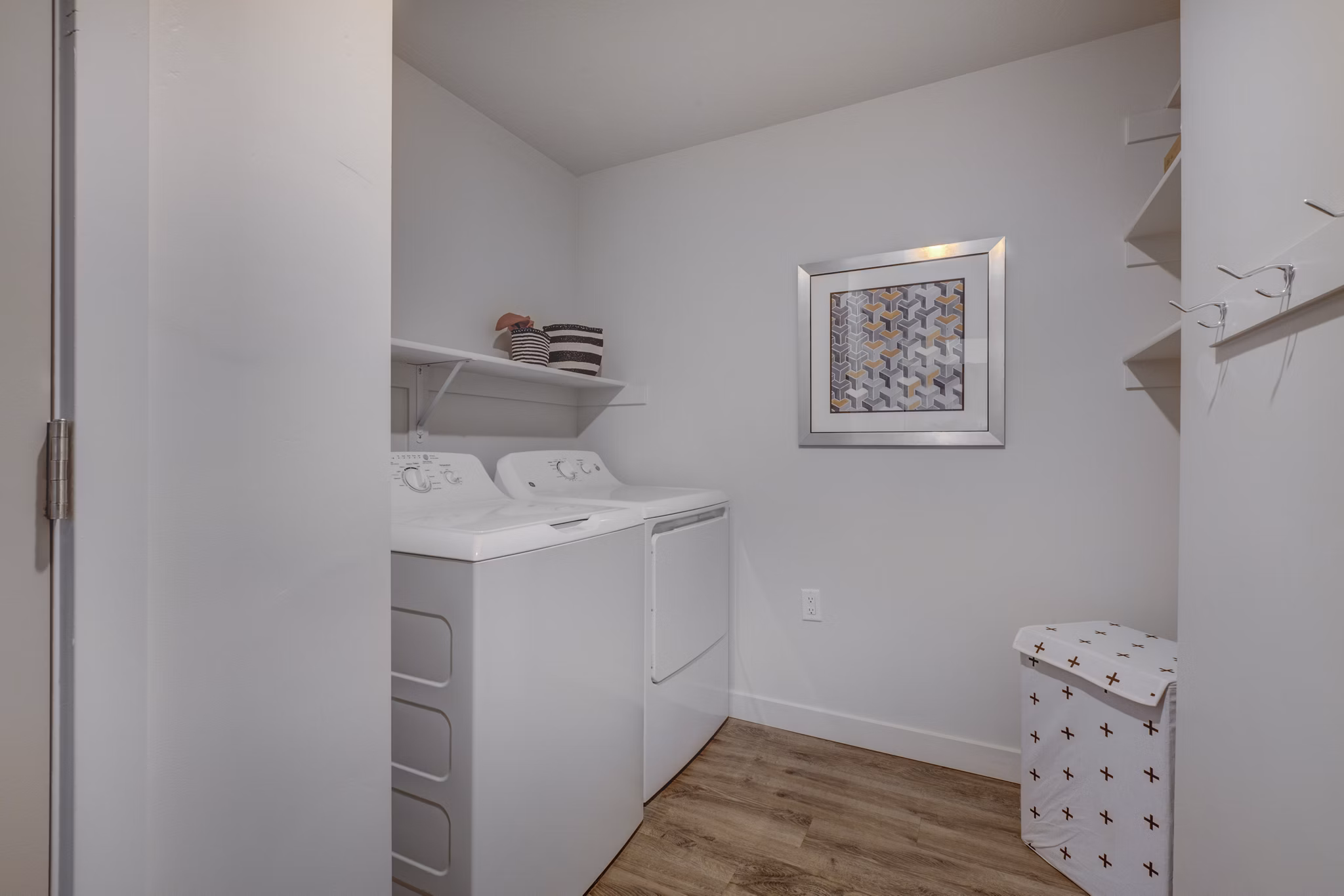 Laundry room with modern washers and dryers at Aspira at Anthem Apartments