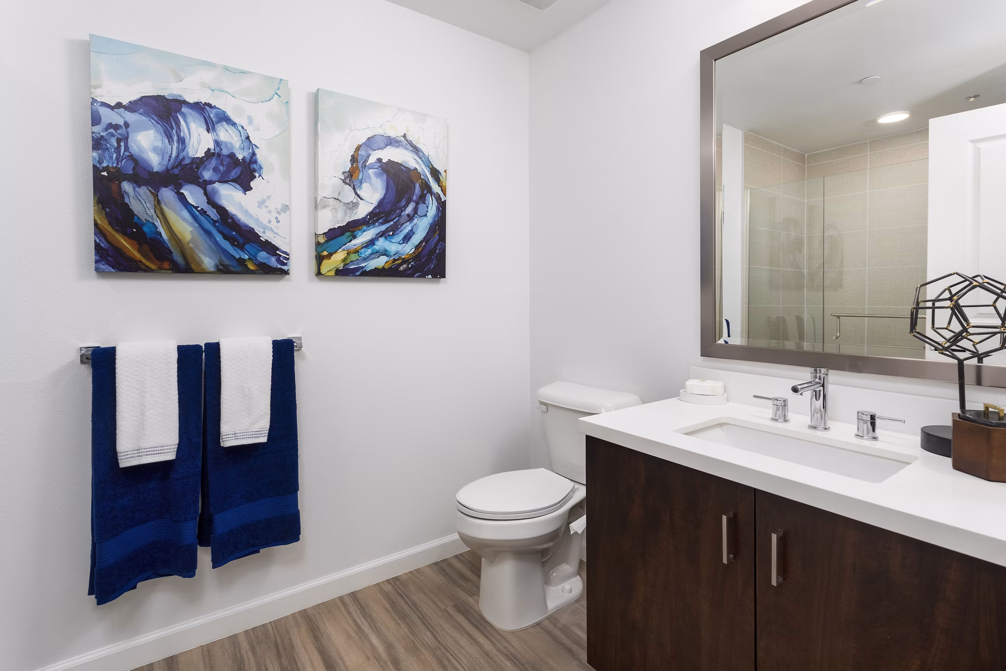 Luxurious bathroom with modern fixtures at 7403 Apartments, featuring sleek design and spacious layout