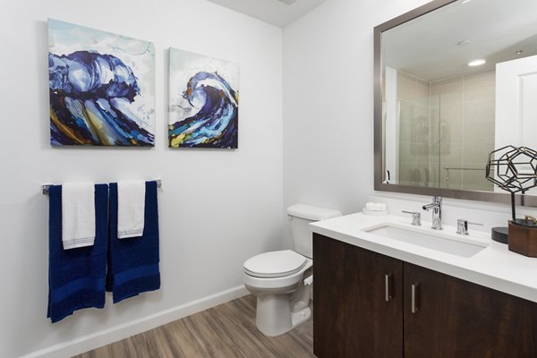 Luxurious bathroom with modern fixtures at 7403 Apartments, featuring sleek design and spacious layout