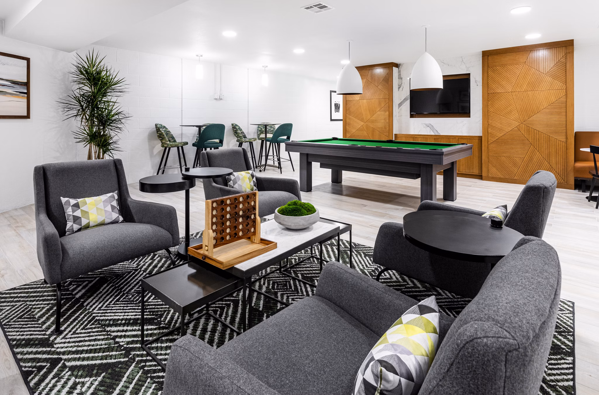 Clubhouse with modern decor and seating at 7403 Apartments