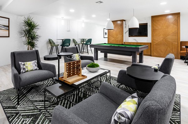 Clubhouse with modern decor and seating at 7403 Apartments