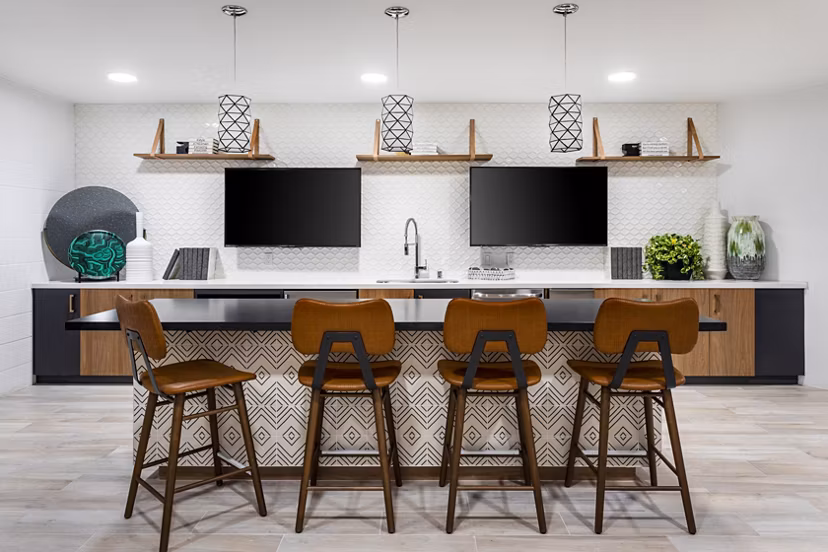 Clubhouse with modern furnishings at 7403 Apartments, a Greystar luxury community