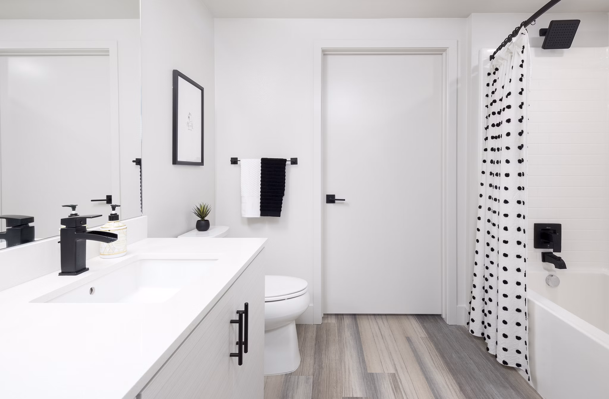 Bathroom featuring stylish fixtures and modern design at Jefferson Edge Apartments