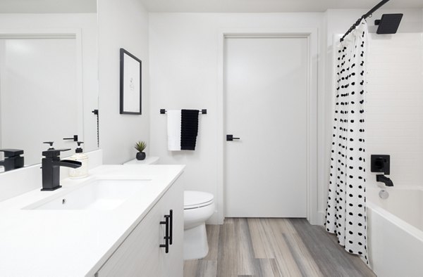 Bathroom featuring stylish fixtures and modern design at Jefferson Edge Apartments