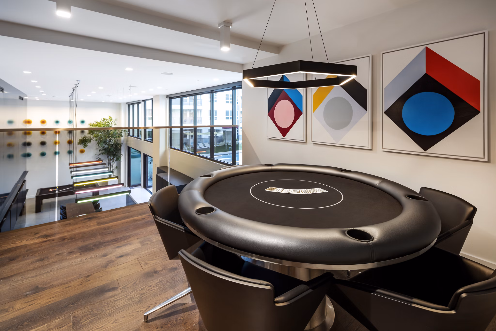 Game room with pool table and arcade games at Jefferson Edge Apartments, luxurious community space for entertainment and recreation