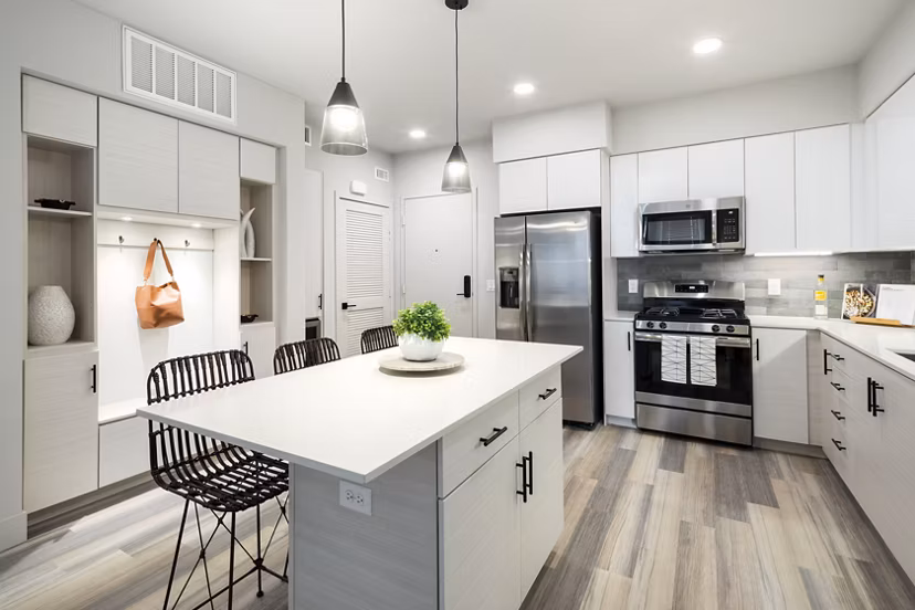 Modern kitchen with stainless steel appliances at Jefferson Edge Apartments