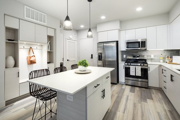 Modern kitchen with stainless steel appliances at Jefferson Edge Apartments